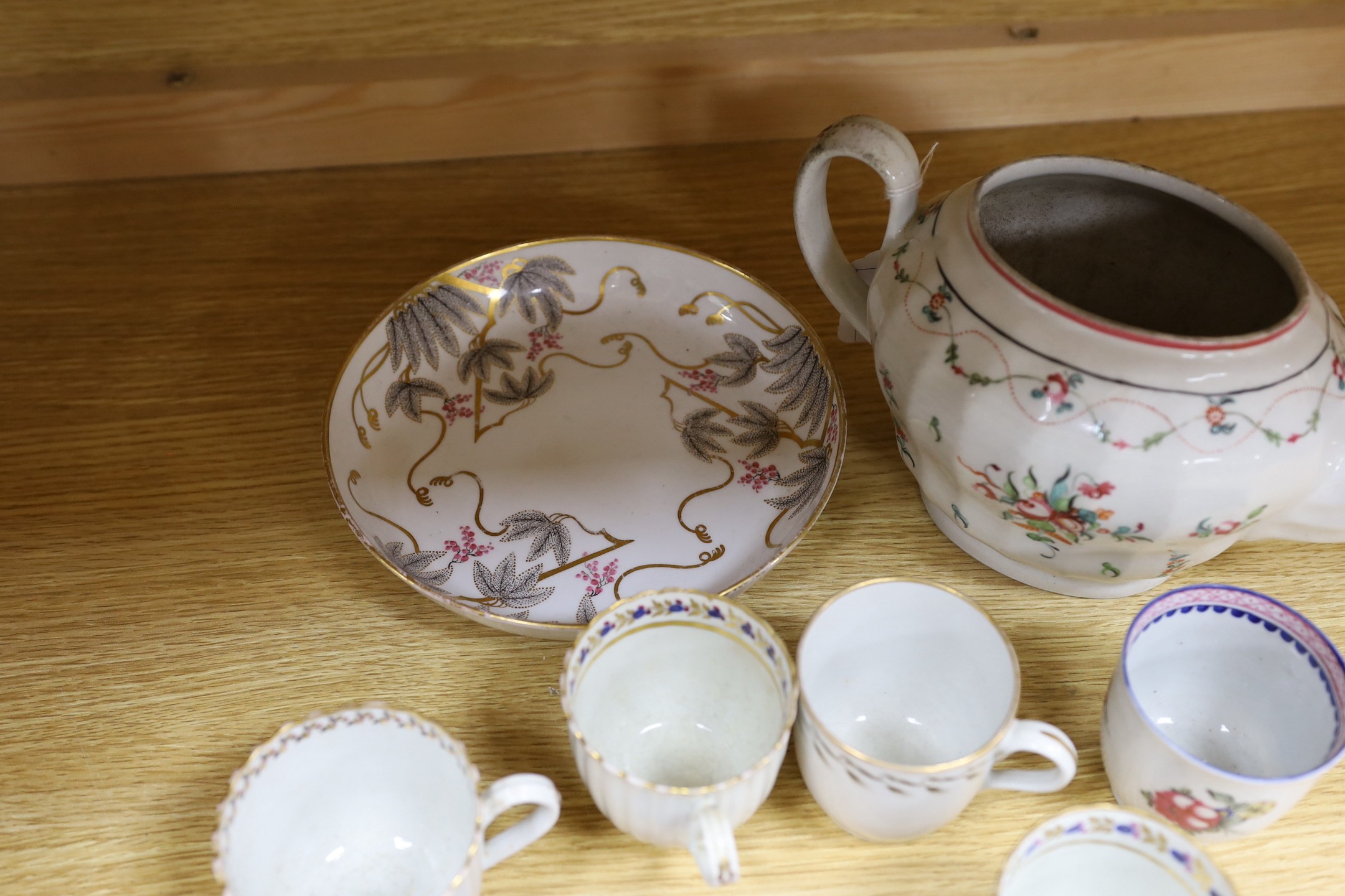 A Newhall saucer dish painted with pattern 85, octagonal Newhall-type spoon tray, clip-handled coffee cup painted with flowers, two ridge handled coffee cups, New Hall pattern 430 coffee cup, Newhall teapot and eight oth